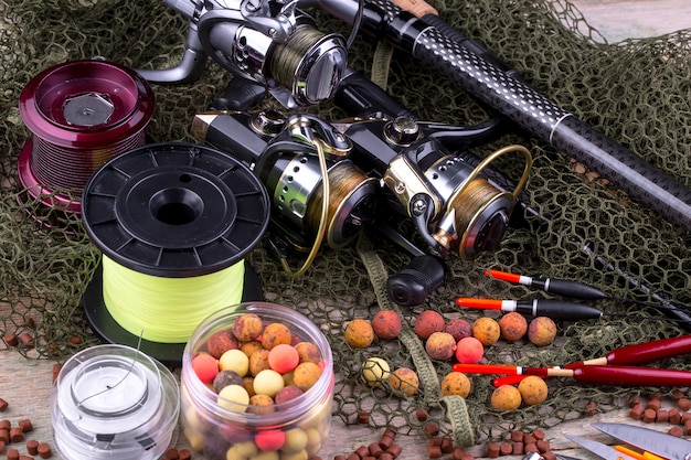 Photo spinning and fishing rods on an old table