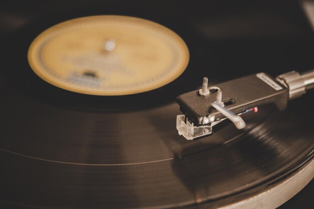 Spinning record player with vintage vinyl turntable player and vinyl record