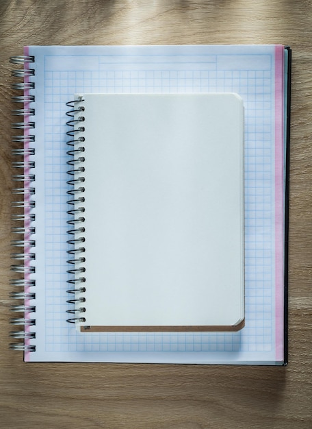 Photo spiral blank copybooks on wooden board