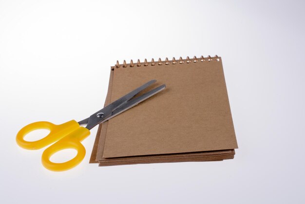 Spiral notebook and scissors