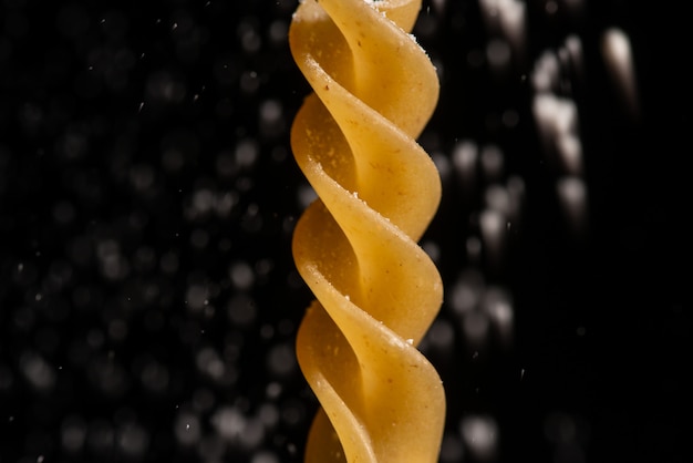 Spiral Pasta Close-Up on Black 