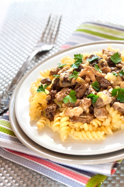 Spiral pasta with morel mushrooms