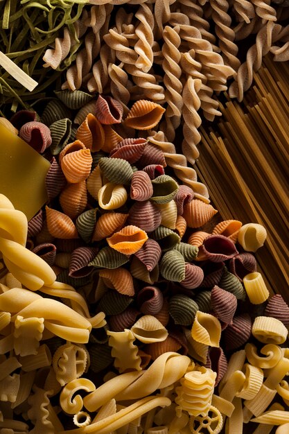 Spiral shaped pasta on wooden table