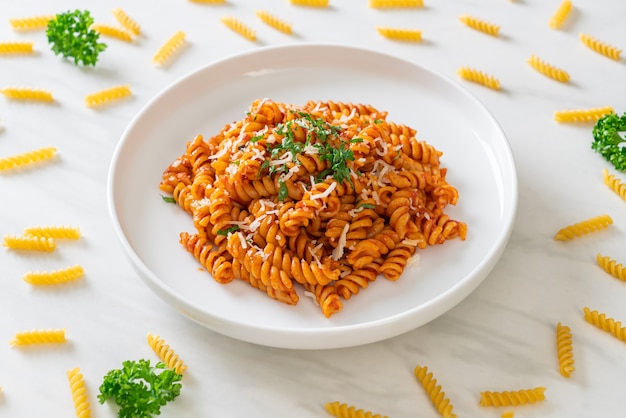 spiral or spirali pasta with tomato sauce and cheese. Italian food style