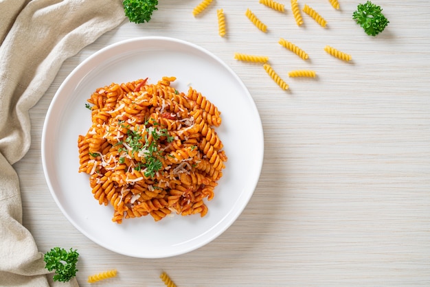 spiral or spirali pasta with tomato sauce and cheese - Italian food style