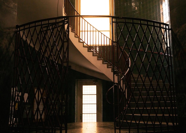 Spiral staircase in a tall multifloor house architecture concert