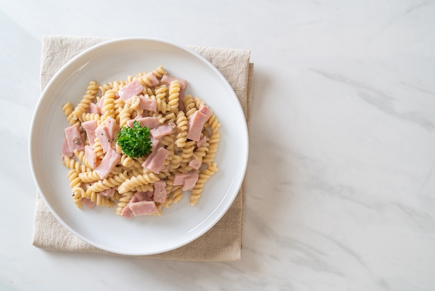 spirali or spiral pasta mushroom cream sauce with ham - Italian food style