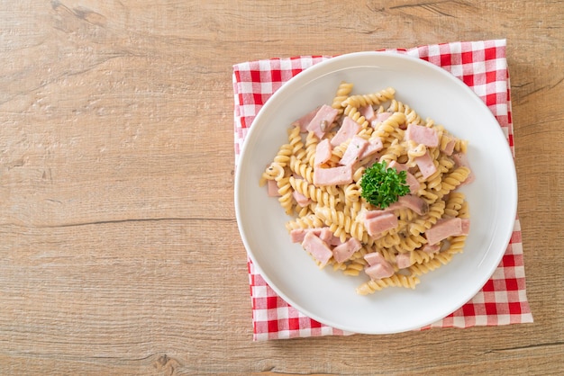 spirali or spiral pasta mushroom cream sauce with ham - Italian food style