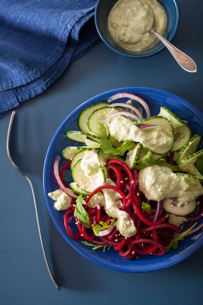 Spiralized beet and cucumber salad with avocado dressing, healthy vegan meal