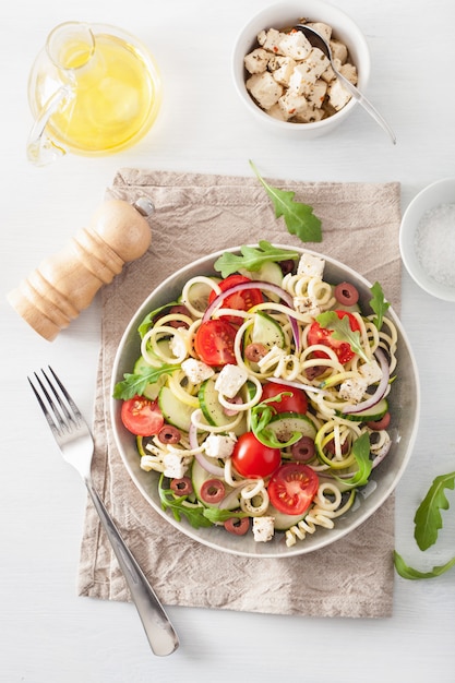 Spiralized courgette salad greek style with tomato feta olives cucumber