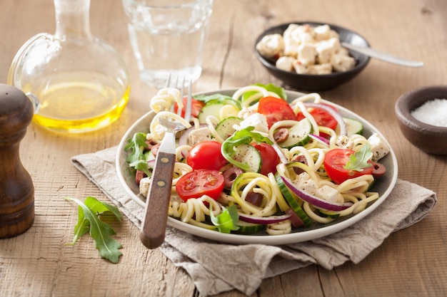 Spiralized courgette salad greek style with tomato feta olives cucumber