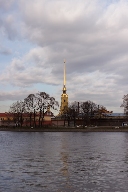 The spire of the Peter and Paul Fortress in the background April sky