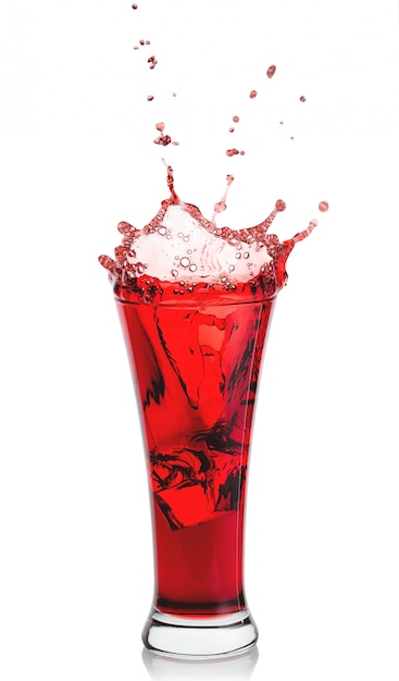 Splash of fragrant natural juice in high transparent glass