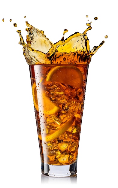 splash of ice tea with lemon in glass isolated on white background