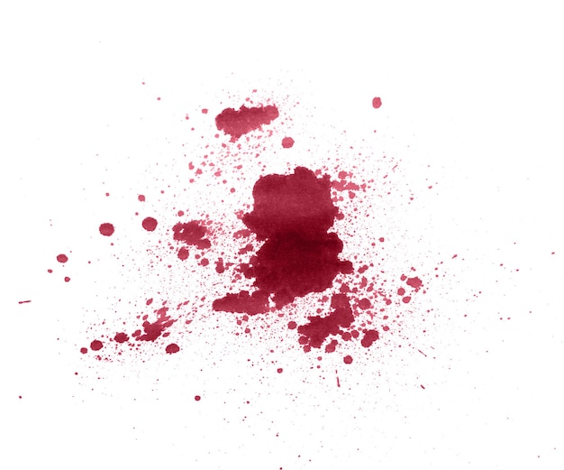 Splash of red ink at white isolated background