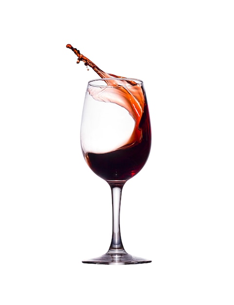 A splash of red liquid in a glass glass isolated on a white background
