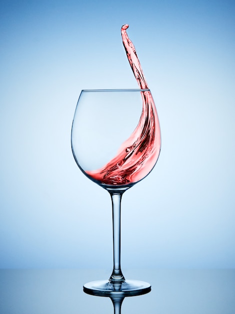 A splash of red wine in a glass