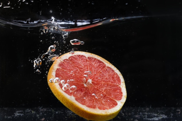 Splash of water with fruits lemon orange