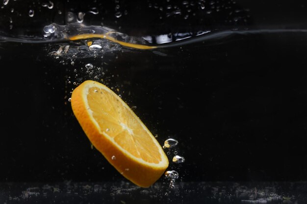 Splash of water with fruits lemon orange