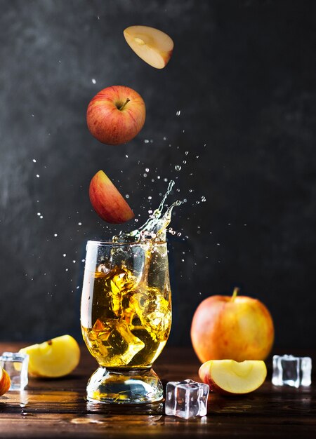 splashing apple juice in a glass