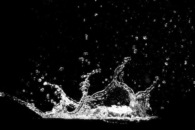 Photo splashing water on a black background water splash refreshing black background