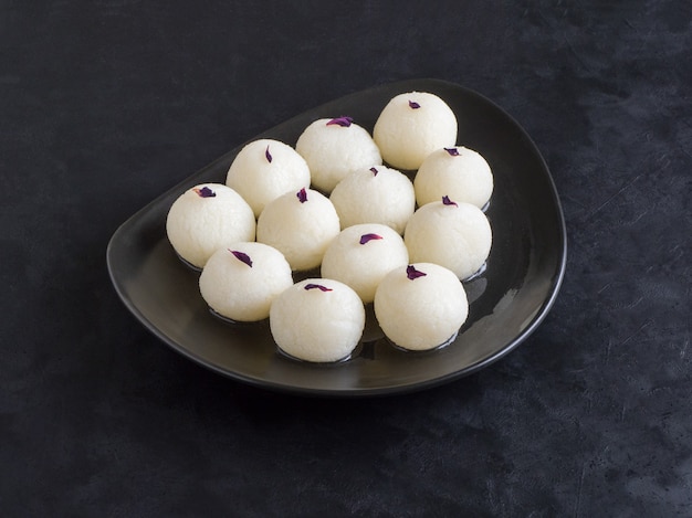 Photo sponge rasgulla sweets, famous indian sweet food. top view