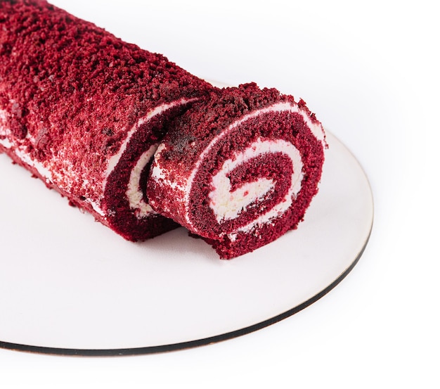 Sponge Swiss roll on white plate