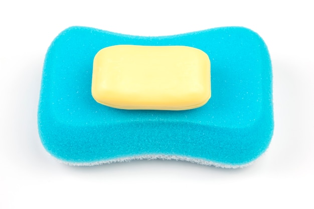 Photo sponge for washing in the bathroom and soap on white