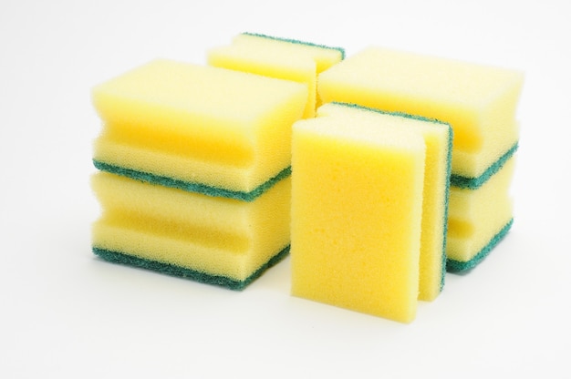 Sponge for washing dishes and plumbing on an isolated white