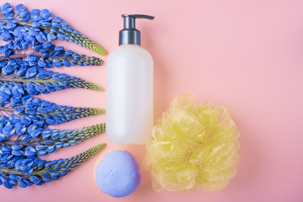 Photo sponge and wildflowers on a pink background