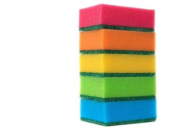 Sponges multicolored for cleaning on a white background a stack