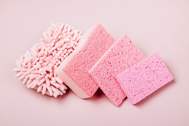 sponges on pink background cleaning or housekeeping concept background