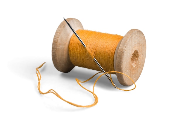 Isolated wooden spool of green thread with a needle 10218377 Stock Photo at  Vecteezy