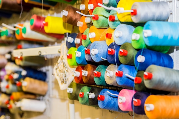 Spools of colorful Thread in sewing Studio