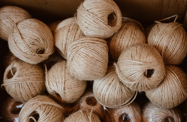 Spools or rolls of brown color linen string