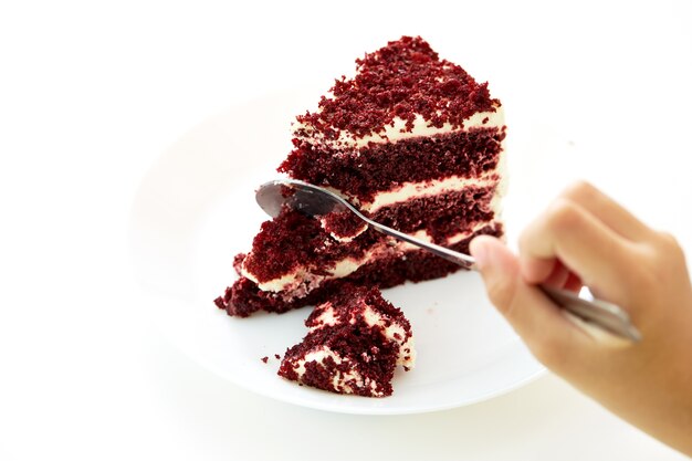 spoon cutting a red dessert