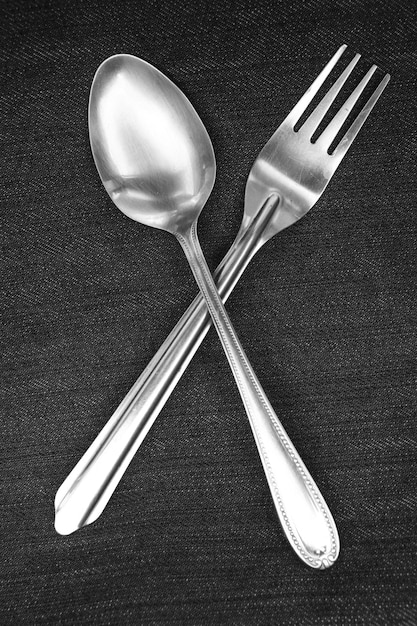 Photo spoon and fork placed on blue and white handkerchiefs