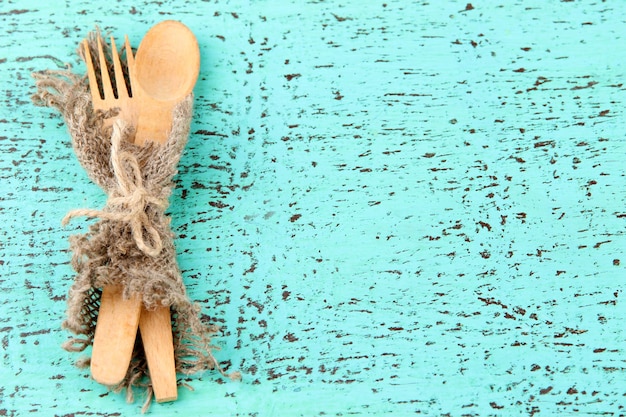 Spoon and fork on wooden table