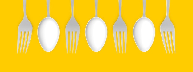 Spoon and fork on a yellow background For the design of a restaurant cafe pizzeria