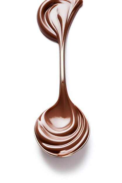 A spoon full of chocolate icing on a white background