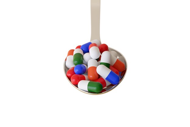 Spoon full of different colored pills isolated.