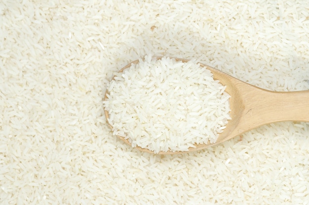 Cucchiaio di riso al gelsomino sfondo.