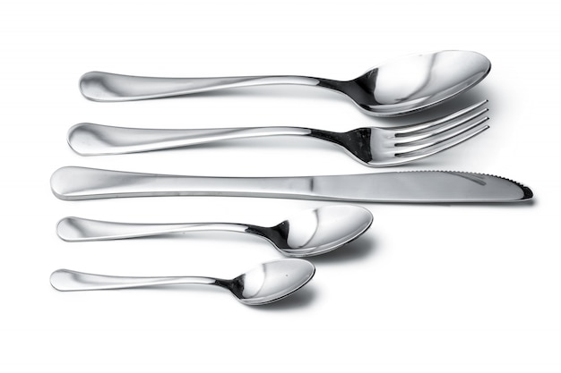 Spoon, knife and fork isolated on white surface