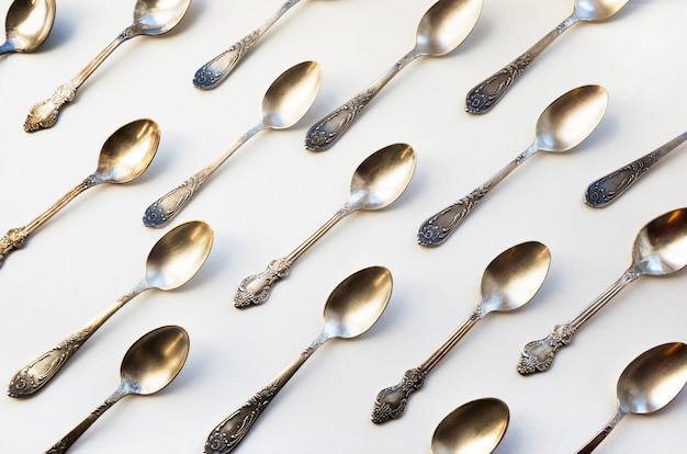 Spoon pattern on white. Kitchen texture.