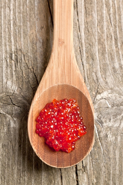 Spoon of red caviar