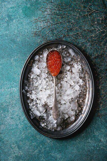 Spoon of red caviar