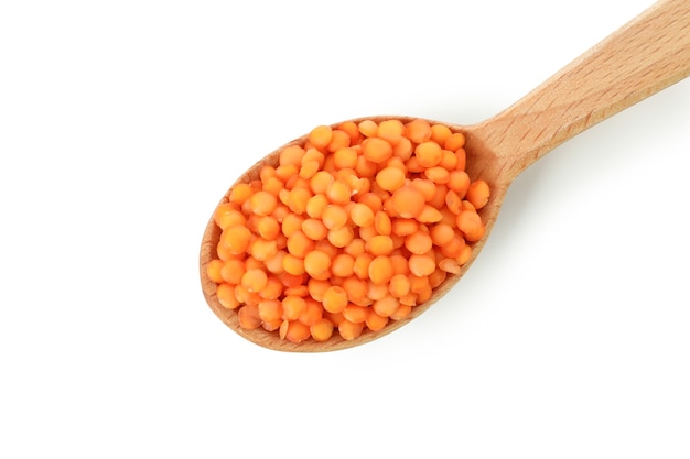 Spoon of red lentils isolated on white background