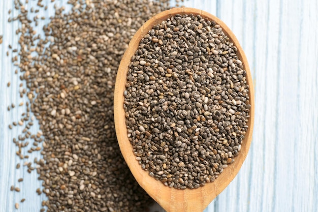 Spoon with chia seeds on table closeup