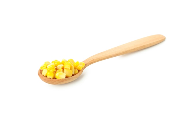 Spoon with corn seeds isolated on white background