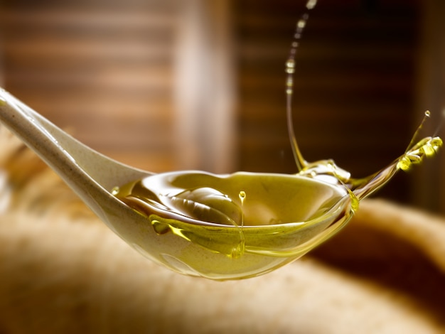 spoon with extra virgin olive oil